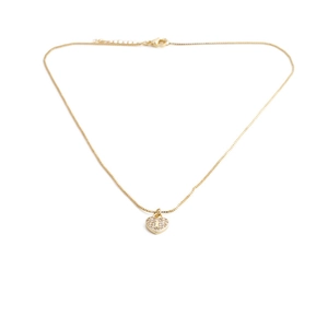 Close-up of gold heart pendant necklace with shimmering crystals and elegant box chain