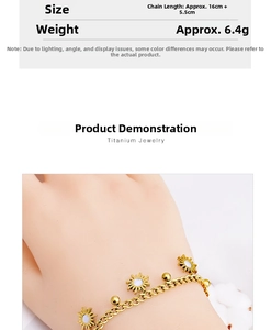 Detail of sunflower charms on gold titanium steel chain showing 16cm plus 5.5cm length