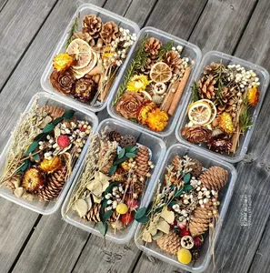 Macro shot of assorted natural dried flowers with pine cones and cinnamon for DIY crafts