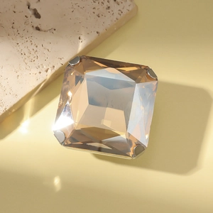Minimalist square champagne crystal ring in silver four-prong setting at 45-degree angle