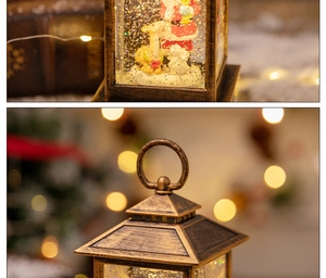 Close-up of vintage bronze Christmas lantern with Santa figurines and festive snow scene