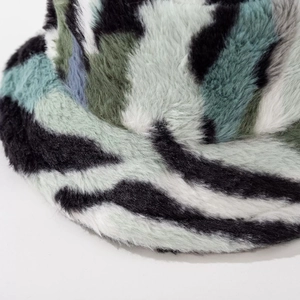 Winter faux fur bucket hat featuring a plush zebra pattern in mixed camo colors