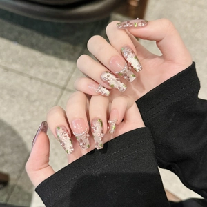Handmade press-on nails featuring French glass beads, pearls, and hand-painted floral art