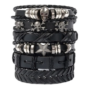 Detailed shot of 6pcs punk leather bracelets with silver skull and star charms