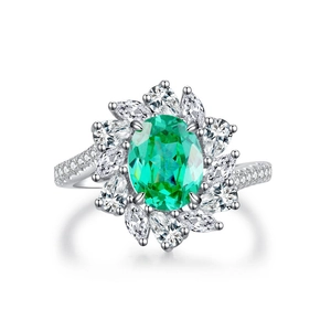 S925 sterling silver ring featuring a large oval green gemstone and zircon halo