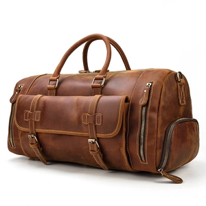 Vintage brown crazy horse leather duffel bag with front buckle pocket and side shoe compartment