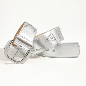 Detail of silver rivets in a triangle pattern on a distressed style vintage leather belt