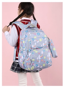 Girl's school backpack with rainbow prints featuring breathable padded shoulder straps