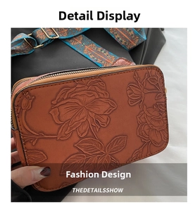 Detail of brown faux leather crossbody bag with rose embossing and woven strap