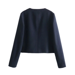 Back view of a dark blue cropped tweed jacket showing premium textured fabric detail