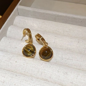 Elegant gold plated tiger eye stone hoop earrings displayed in a luxury jewelry box