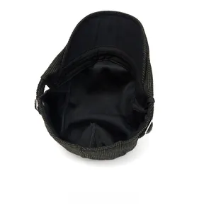 Detailed view of internal black breathable lining and sewing of the herringbone beret