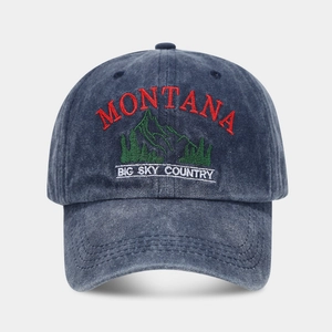 Vintage washed navy baseball cap featuring Montana mountain embroidery and adjustable strap