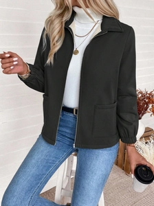 Detail of black zip-up jacket with lapel collar and large side pockets for women