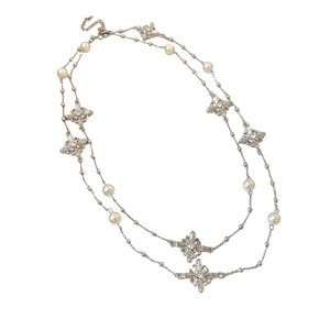 Double-layered pearl necklace with silver cross pendant and sparkling rhinestones