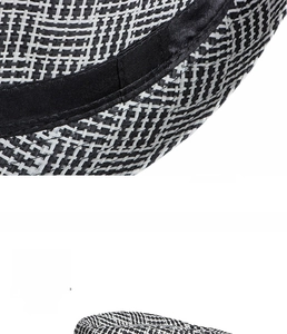 Close-up of black and white woven straw texture and inner sweatband of a fedora hat