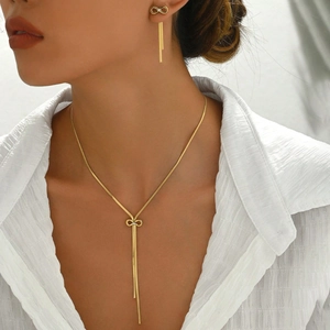 Elegant gold-plated stainless steel jewelry set featuring bowknot design and long tassels