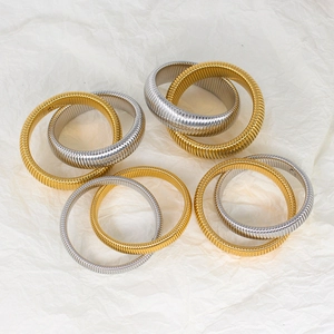 Minimalist double layer striped tubogas bangles in polished gold and silver metal finishes