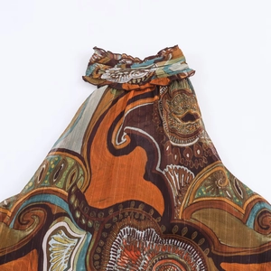 Sleeveless paisley print top for women featuring metallic threads and halter neckline