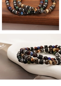Detailed close-up of mixed natural stone beads with volcanic rock and metal spacers
