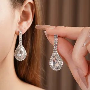 Elegant silver teardrop earrings set with cubic zirconia diamonds for a luxury look