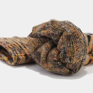 Detail of thick tie-dye knit beanie scarf and gloves set with warm fleece lining
