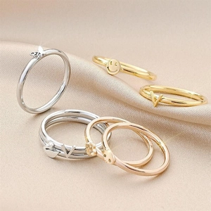 Minimalist titanium steel butterfly and smile ring set in gold, silver, and rose gold finishes