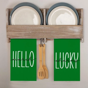Detail of St. Patrick's Day kitchen towels with Hello March and Lucky Charms design