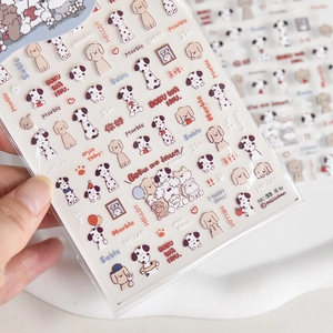 Detail of thin dog nail stickers featuring dalmatians and hand-drawn puppy illustrations
