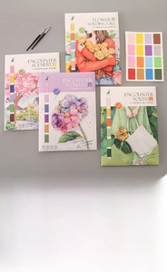 Detail view of 4 watercolor coloring cards with built-in paint palettes and brushes