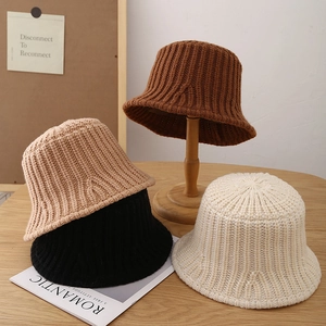 Knitted bucket hats for women in four warm colors with vertical striped wool texture