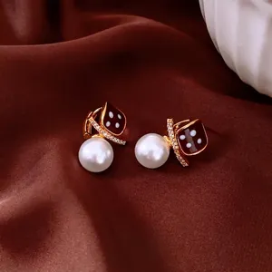 Vintage gold plated square dice earrings with white pearls and zircon on red silk
