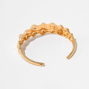 Irregular gold wave-pattern open cuff bracelet with textured brushed finish for women