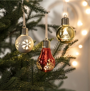 Close-up of red, gold, and white Christmas bulb ornaments with Merry Christmas text