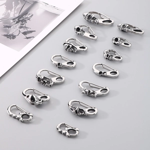 Detailed collection of 13 silver vintage skull-shaped stainless steel clasps and hooks