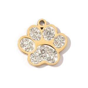 Close-up of golden dog paw pendant with sparkling rhinestones for jewelry making