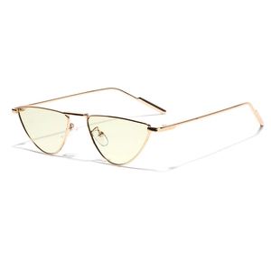 Retro pointed cat eye sunglasses with gold metal frame and stylish light yellow lenses