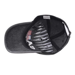 Detail view of cotton baseball cap interior featuring USA flag embroidery and washing label
