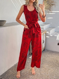 Detail of red and black print sleeveless jumpsuit with high waist tie and side pockets
