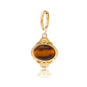 Detail view of oval tiger eye stone pendant on golden stainless steel hoop earring