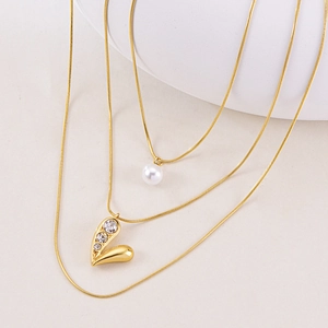 Multi-layer gold necklace with white pearl and sparkling heart pendant jewelry