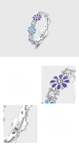 Detail of 925 sterling silver ring featuring purple enamel flowers and 5A cubic zirconia
