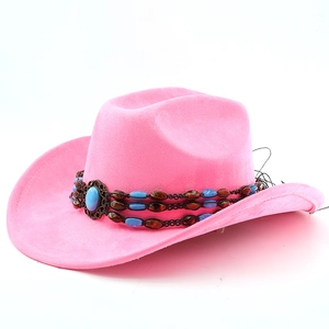 Detail of pink faux suede cowboy hat featuring a turquoise beaded band and center gemstone