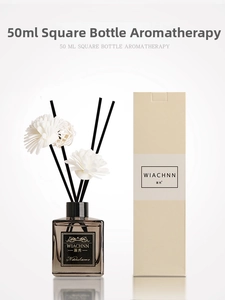 Detailed view of 50ml gardenia reed diffuser set with brown glass bottle and sola flower