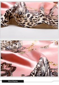 Detail of pink satin scarf with leopard print, golden chains and premium hemmed edges