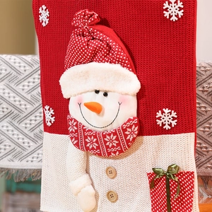 Knitted Christmas chair cover with 3D snowman detail for holiday dining room decor