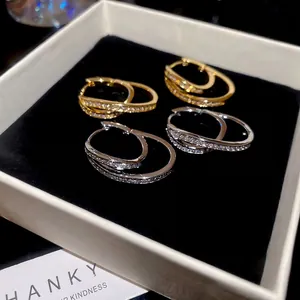 18k gold plated U-shaped hoop earrings with zircons in gold and silver finishes