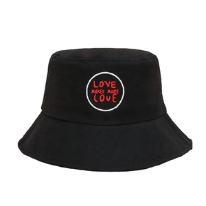 Black canvas bucket hat with red LOVE MAKES MORE LOVE embroidery and white circular badge