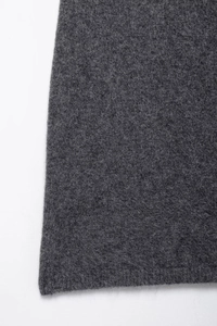 Close-up macro view showing the high-quality dark grey wool knit fabric texture and fibers