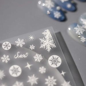 5D-Schneeflocken-Nagelaufkleber mit weißen Wintermustern und Snow-Kalligraphie auf Folie